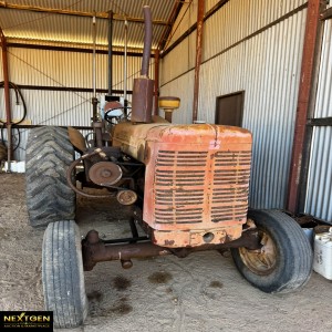 McCormick International Tractor with Posthole Digger