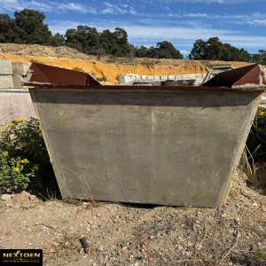 One cement block with large steel bracket attached